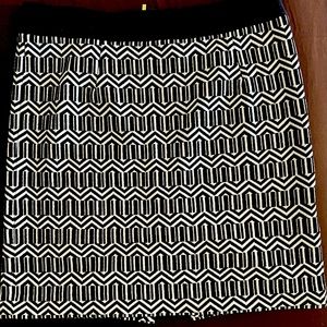 Beautiful black and white skirt. Size 8, spandex material, and comfortable.